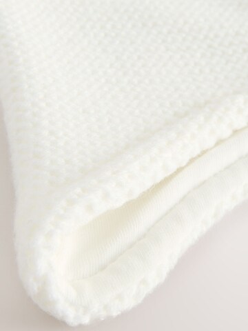 balta Next Megzta kepurė