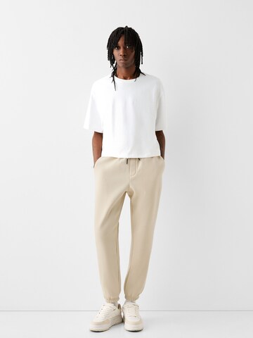 Bershka Tapered Hose in Beige