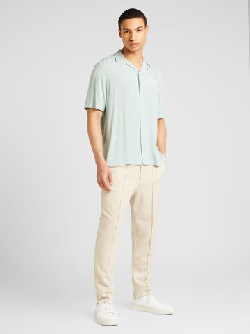 žalia AllSaints Standartinis modelis Marškiniai 'UNDERGROUND'
