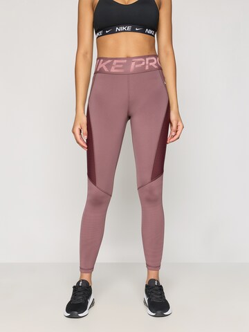 NIKE - Skinny Calças de desporto em roxo: frente