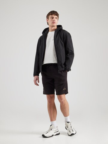 Loosefit Pantaloni di ARMANI EXCHANGE in nero
