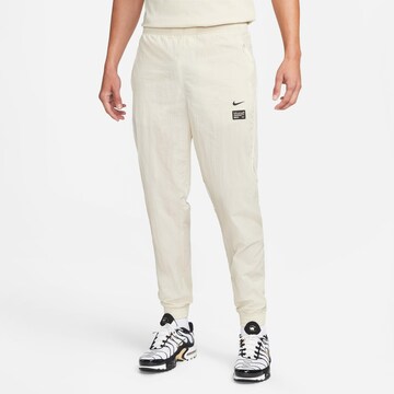 NIKE Tapered Outdoor Pants 'FC' in Beige: front
