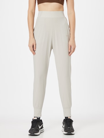 NIKE Tapered Sports trousers 'Bliss Luxe' in Grey: front