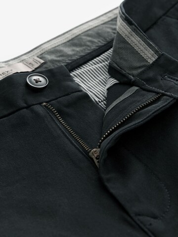 Loosefit Pantaloni chino di Next in nero