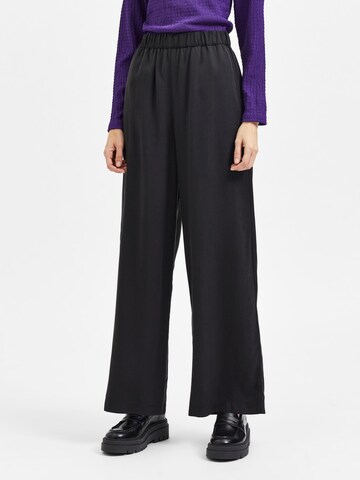 SELECTED - Pierna ancha Pantalón en negro: frente