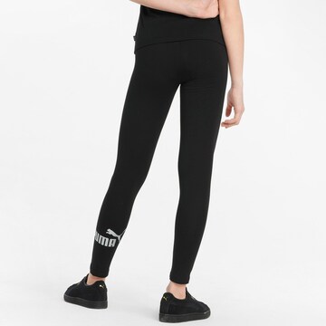 PUMA Skinny Leggingsit 'ESS+' värissä musta