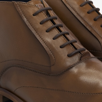 DenBroeck Lace-Up Boots in Brown