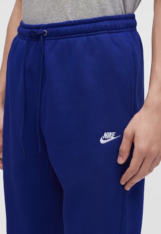 Nike Sportswear Tapered Housut 'CLUB' värissä sininen