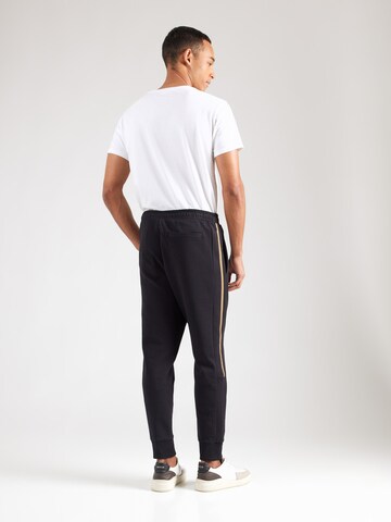 Tapered Pantaloni 'Hadikonos' di BOSS in nero