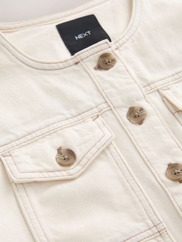 Next Přechodná bunda – béžová