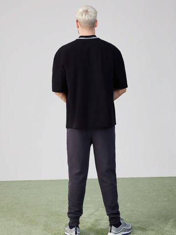 ABOUT YOU x Rewinside Shirt 'Cem' in Black