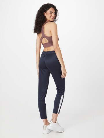 Effilé Pantalon de sport PUMA en bleu