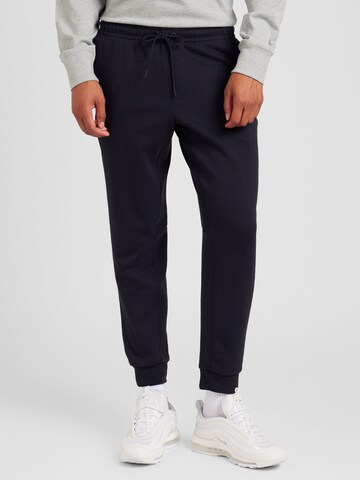 Tapered Pantaloni sportivi 'PRIMARY' di NIKE in nero: frontale