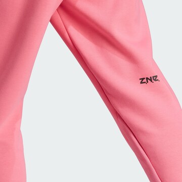ADIDAS SPORTSWEAR Tapered Sportbroek 'Z.N.E. Premium' in Roze