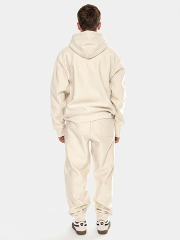 Carhartt WIP Baggy Pants 'American Script Jogging Pant Moonbeam' in Beige