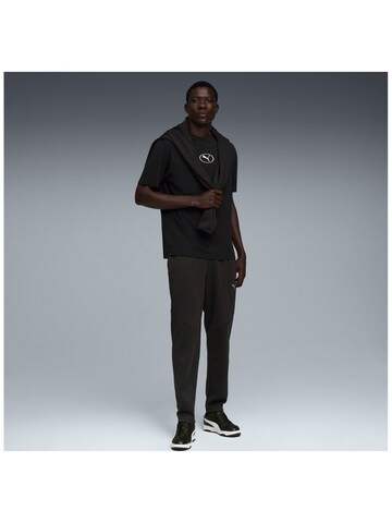 PUMA - regular Pantalón deportivo 'Puma Evostripe Warm Pants' en negro