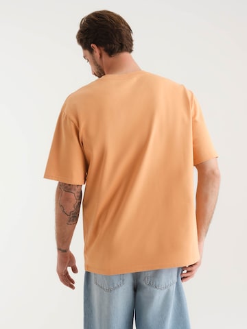 ABOUT YOU x Kevin Trapp T-Shirt 'Lorenz' (GOTS) in Orange