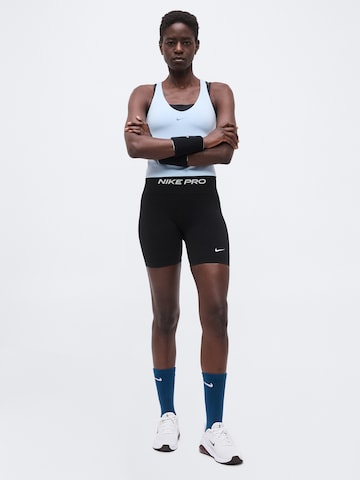 Skinny Pantaloni sport 'Seamless' de la NIKE pe negru