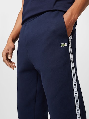 LACOSTE - Tapered Calças em azul