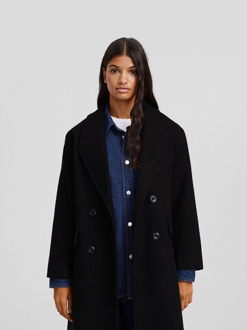 Bershka Between-seasons coat in Black: front