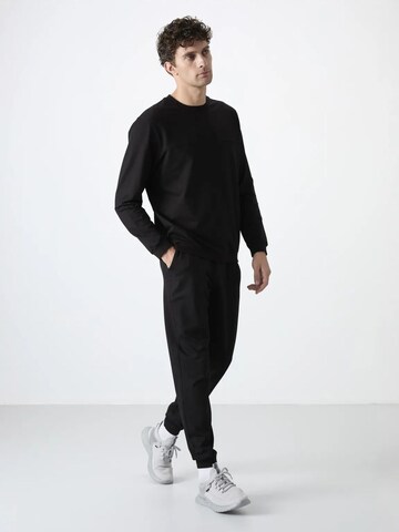 Tuta da jogging di Tommy Life in nero: frontale