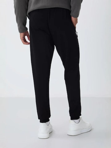 Regular Pantalon de sport Tommy Life en noir