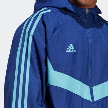 ADIDAS SPORTSWEAR Αθλητικό μπουφάν 'Tiro Warm' σε μπλε