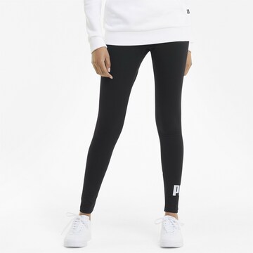 PUMA Skinny Workout Pants in Black: front