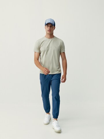 Born Living Yoga Tapered Weatherproof pants 'Minho' in Blue