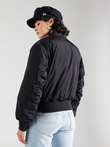 Tommy Jeans Tussenjas 'ESSENTIALS' in Zwart