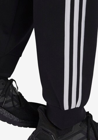 ADIDAS SPORTSWEAR Tapered Urheiluhousut värissä musta