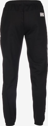 Effilé Pantalon de sport Hummel en noir