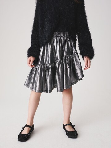 Next - Falda en plata: frente