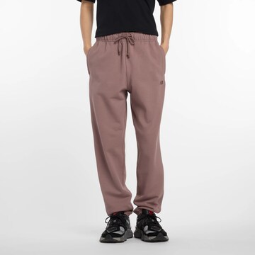 new balance Tapered Pants in Brown: front