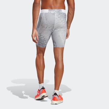 Skinny Pantaloni sportivi 'Adizero Saturday' di ADIDAS PERFORMANCE in grigio