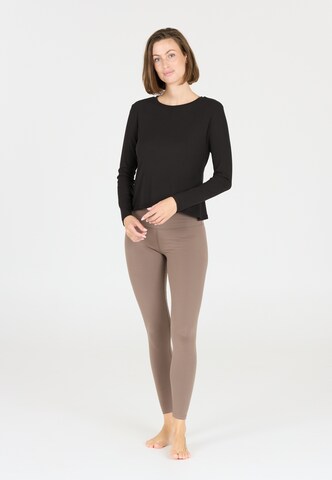 Athlecia Functioneel shirt 'Mandes' in Zwart