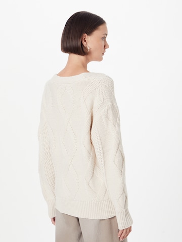 ABOUT YOU Sweater in Beige