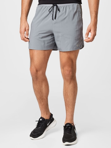NIKE Regular Sports trousers in Grey: front
