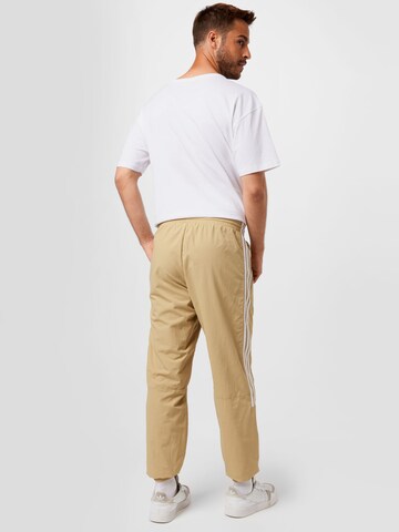 Tapered Pantaloni di ADIDAS ORIGINALS in beige