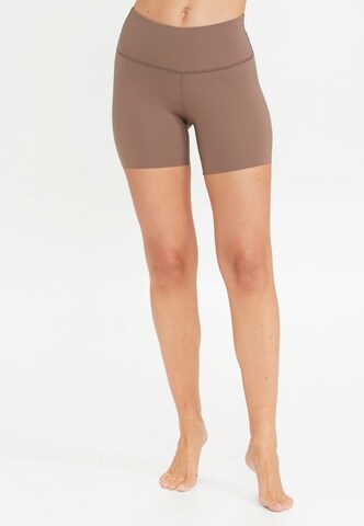 Athlecia Skinny Workout Pants 'Almy' in Brown: front