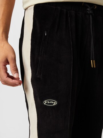 regular Pantaloni 'IAM' di Grimey in nero