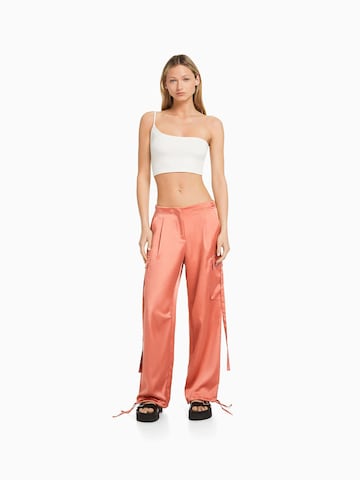 Bershka Tapered Cargo Pants in Orange