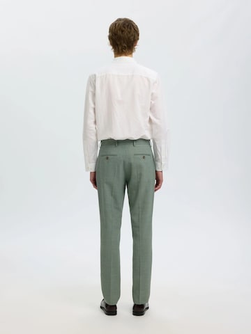 Slimfit Pantaloni '16087871' di SELECTED in verde