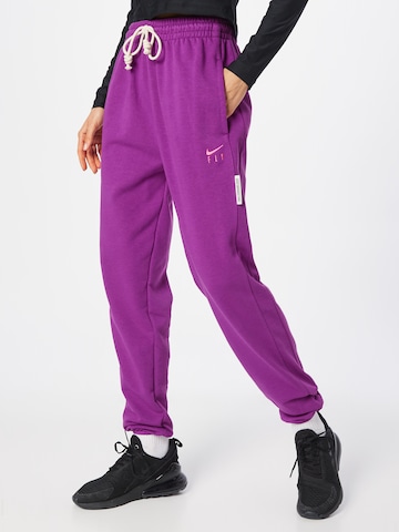 NIKE Tapered Sports trousers in Pink: front