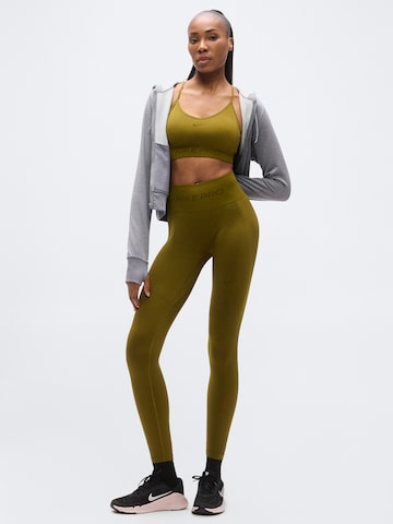 NIKE - Soutien Bustier Soutien de desporto em verde