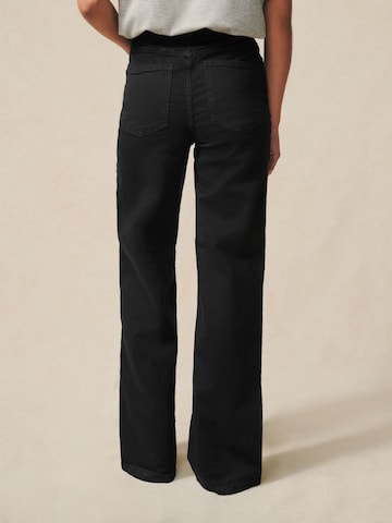 Next Zvonové kalhoty Džíny – černá