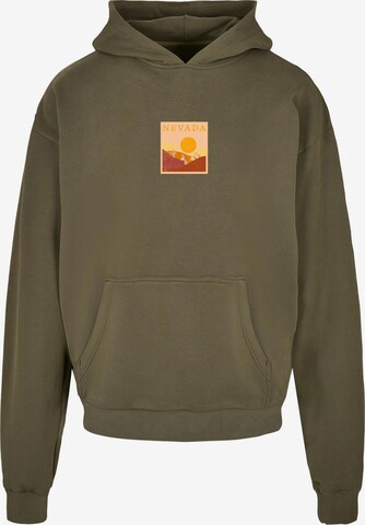 Merchcode Sweatshirt 'Peanuts - Nevada' in Green: front