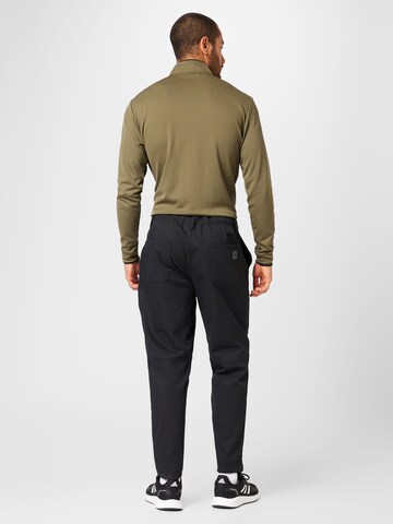 Effilé Pantalon de sport ADIDAS GOLF en noir