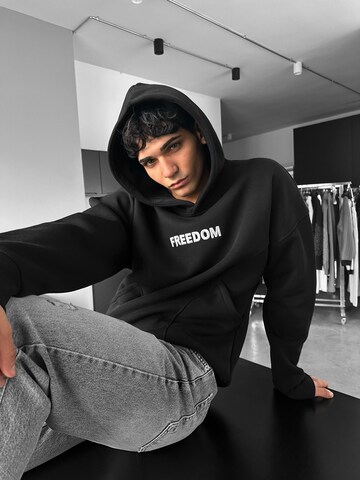 Sweat-shirt 'Oversize Stitches Hoodie - Black' Kleidermafia en noir