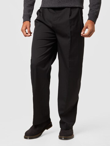Calvin Klein Regular Pleat-front trousers in Black: front